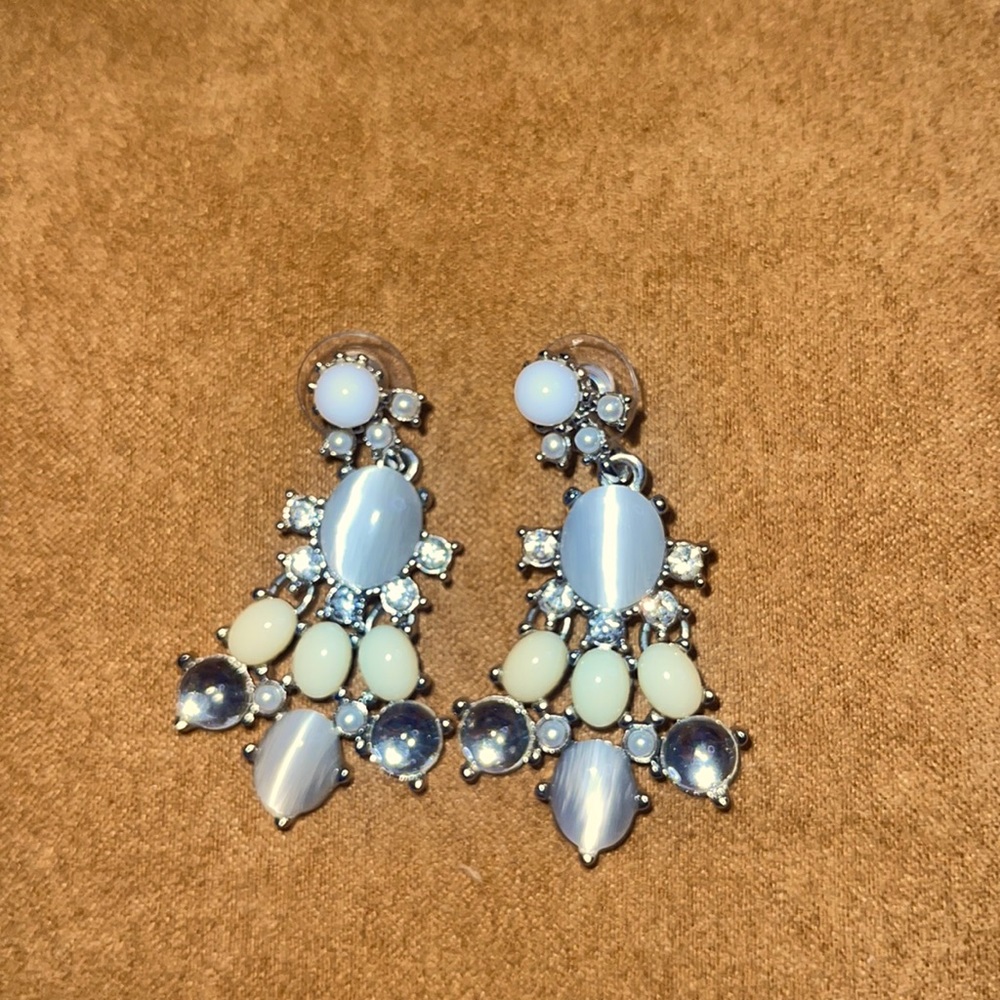 Shades of white,gray,crystal and silver chandelier earrings with post back.